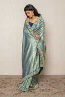 Teal Green Brocade Silk blend Saree With Intricate Zari Border