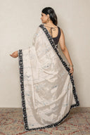Elegant Silver Shimmer Tissue Saree With Black Chekered Border
