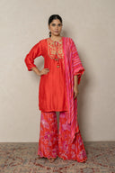 Coral kurta with tropical print pants andbeads embellishment