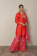 Coral kurta with tropical print pants andbeads embellishment