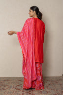 Coral kurta with tropical print pants andbeads embellishment